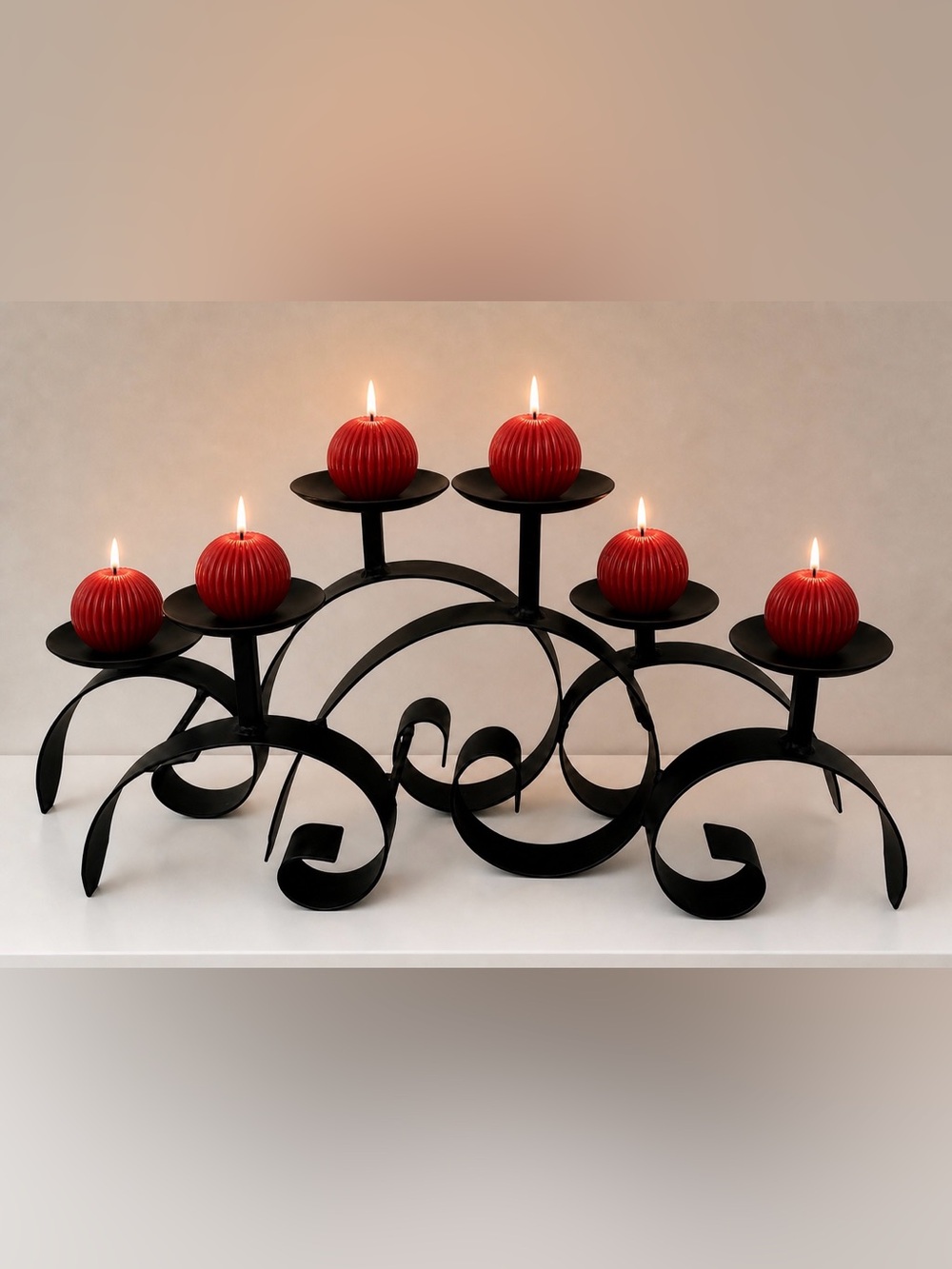 Black Curved Metal Candle Holder displayed with stylish Ball Candles.